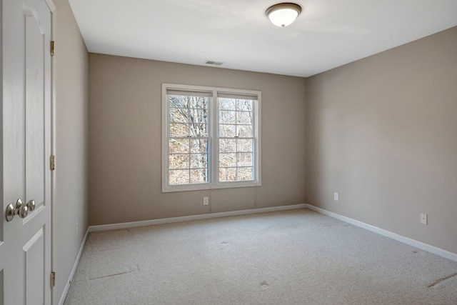 empty room featuring light carpet