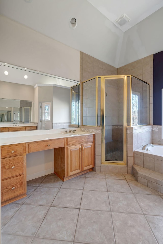 bathroom with vanity, tile patterned floors, and independent shower and bath