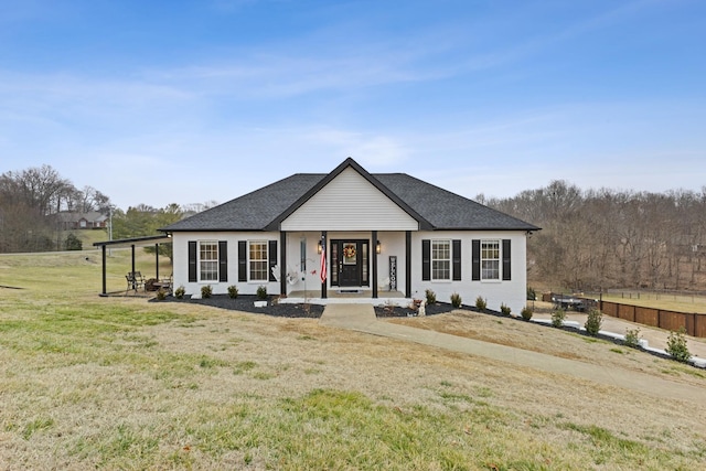 view of front facade with covered porch and a front yard