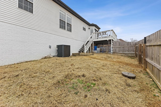 exterior space featuring central air condition unit and a deck