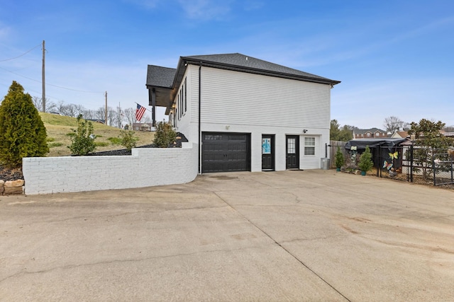 view of property exterior featuring a garage