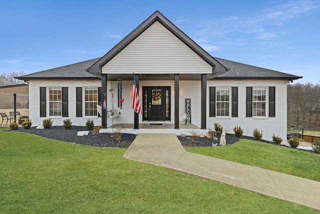 view of front facade with a front lawn and a porch