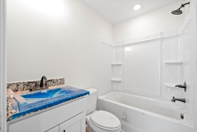 full bathroom with vanity, shower / washtub combination, and toilet