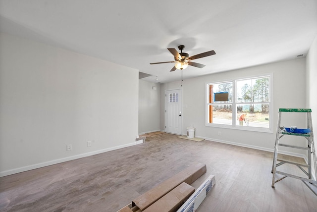 spare room featuring ceiling fan and light hardwood / wood-style floors