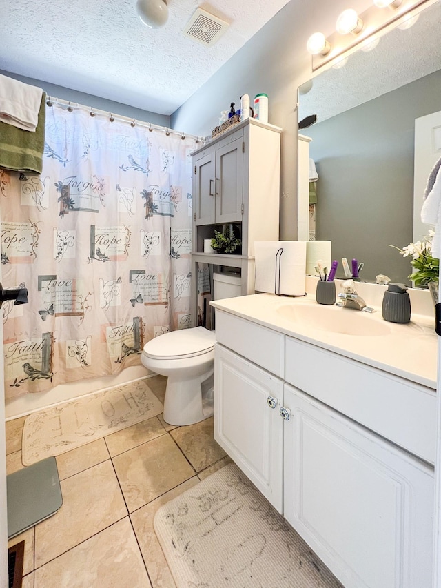 full bathroom with shower / bath combo, tile patterned flooring, vanity, a textured ceiling, and toilet