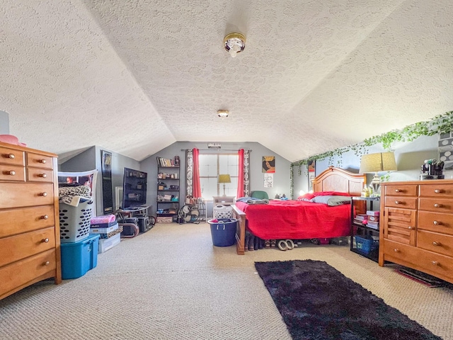 carpeted bedroom featuring vaulted ceiling and a textured ceiling