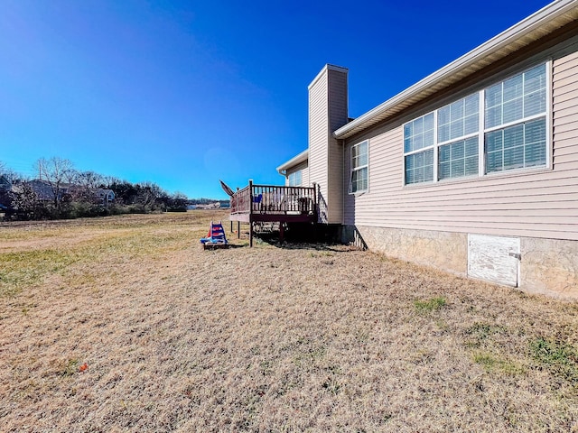 view of yard featuring a wooden deck