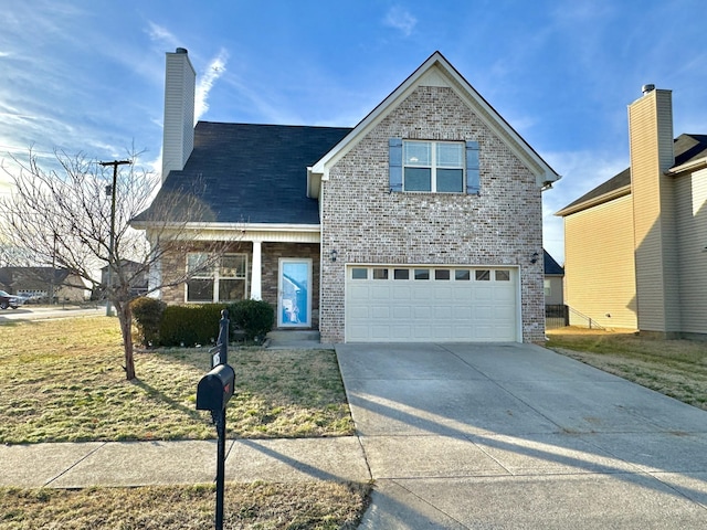 view of property featuring a garage and a front yard