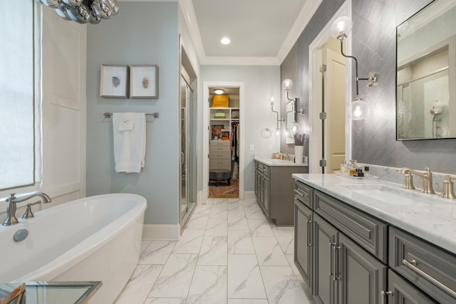 bathroom featuring ornamental molding, independent shower and bath, and vanity