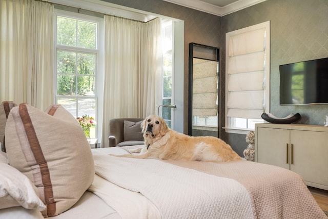 bedroom featuring crown molding