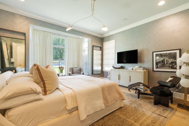 bedroom featuring crown molding, access to outside, and light hardwood / wood-style floors