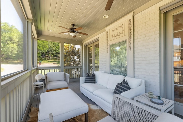 sunroom / solarium with wood ceiling and ceiling fan