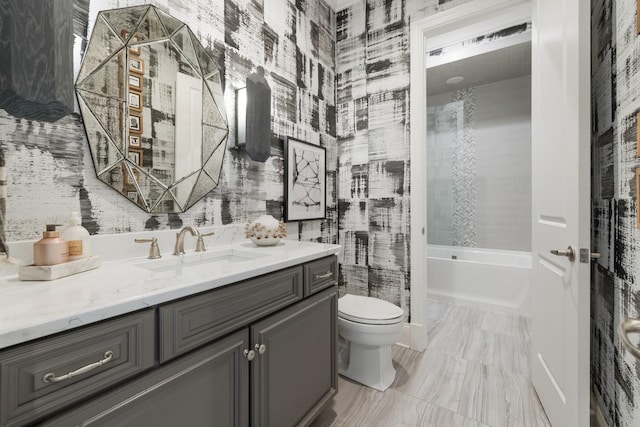 full bathroom with vanity, bathing tub / shower combination, and toilet