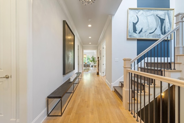 hallway featuring hardwood / wood-style floors and ornamental molding