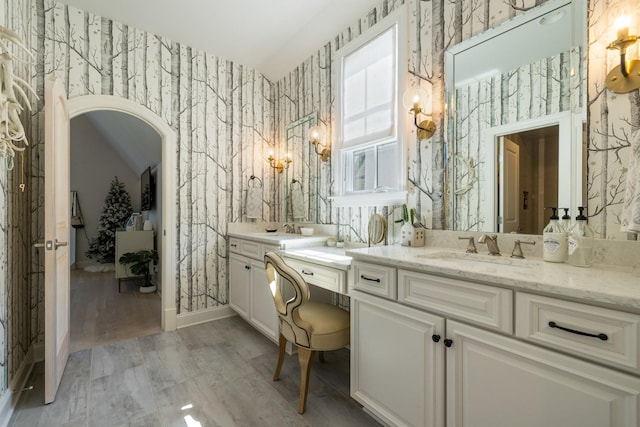 bathroom featuring vanity and hardwood / wood-style floors