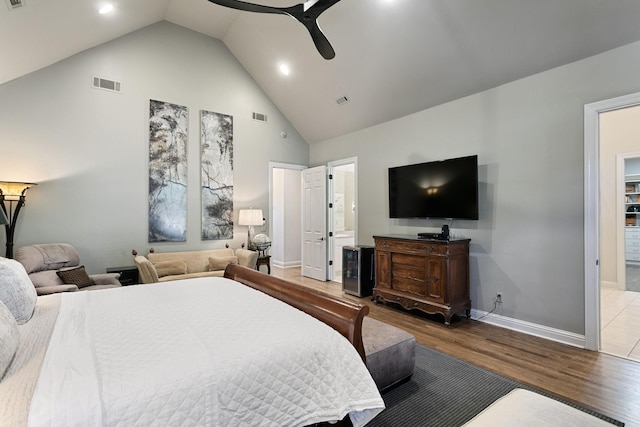 bedroom featuring hardwood / wood-style floors, high vaulted ceiling, and ceiling fan