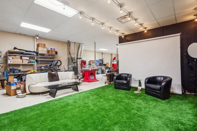 interior space with a paneled ceiling