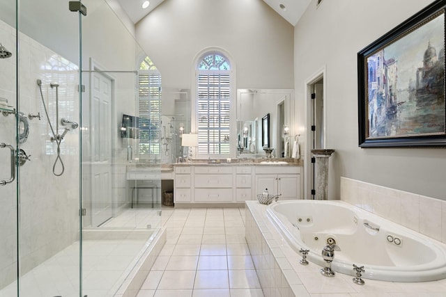 bathroom with vanity, separate shower and tub, tile patterned floors, and high vaulted ceiling