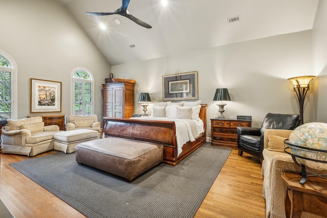 bedroom featuring ceiling fan, high vaulted ceiling, and light wood-type flooring