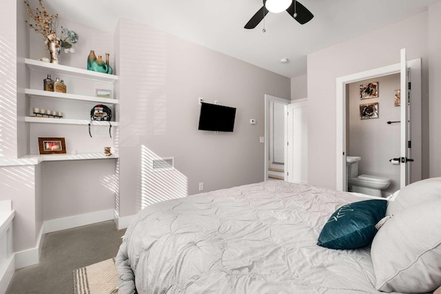 bedroom featuring carpet, ensuite bath, a ceiling fan, and baseboards