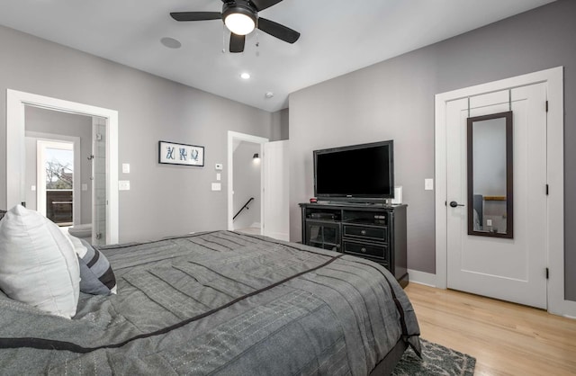 bedroom featuring ceiling fan, light wood-style flooring, and recessed lighting