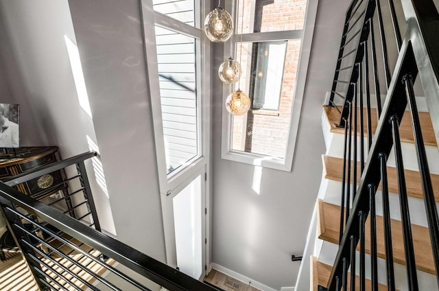 foyer featuring stairs, visible vents, and baseboards