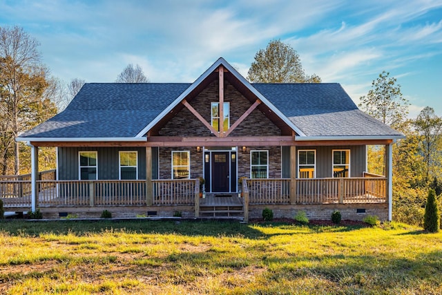 view of front of home featuring a front yard and covered porch