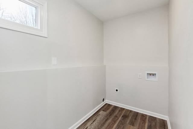 clothes washing area with electric dryer hookup, washer hookup, and dark hardwood / wood-style flooring