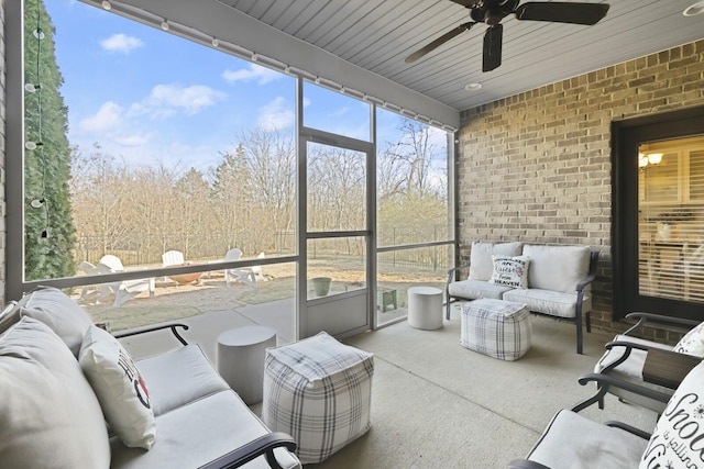 sunroom / solarium with wooden ceiling and ceiling fan