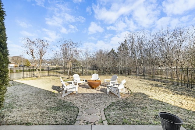 view of yard featuring a patio and an outdoor fire pit