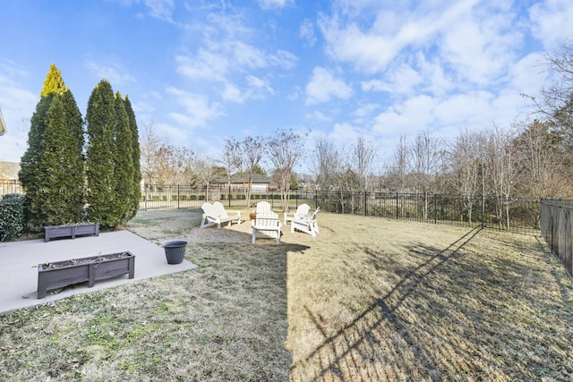 view of yard featuring a patio and a fire pit