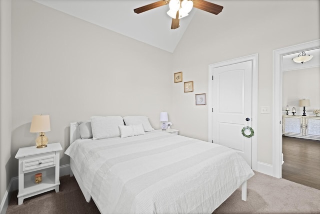 carpeted bedroom with ceiling fan and vaulted ceiling