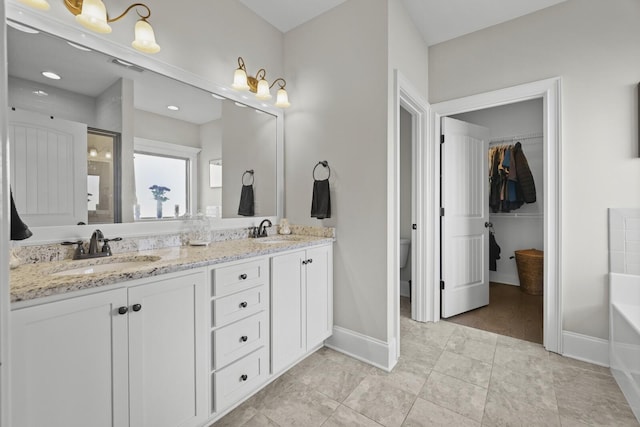 bathroom with vanity, tile patterned floors, and a shower with door