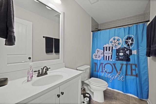 bathroom featuring tile patterned flooring, vanity, a shower with shower curtain, and toilet