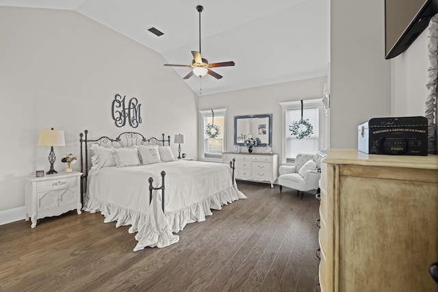 bedroom with lofted ceiling, dark wood-type flooring, and ceiling fan