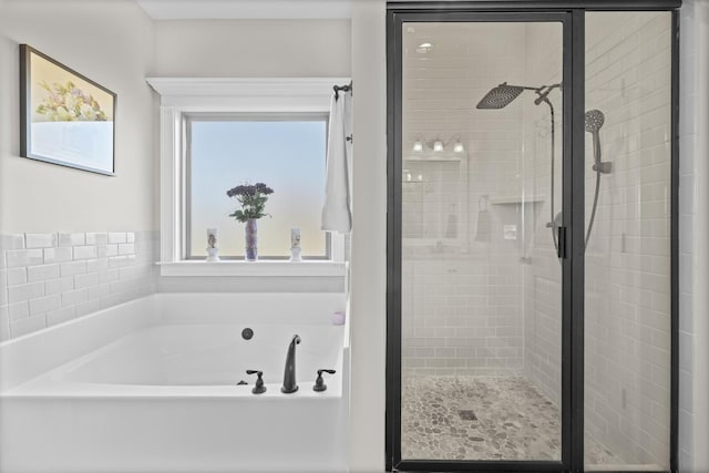 bathroom with separate shower and tub