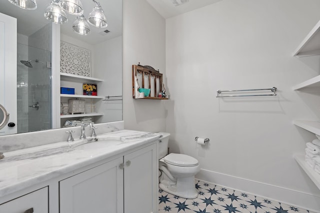 bathroom featuring vanity, toilet, and walk in shower