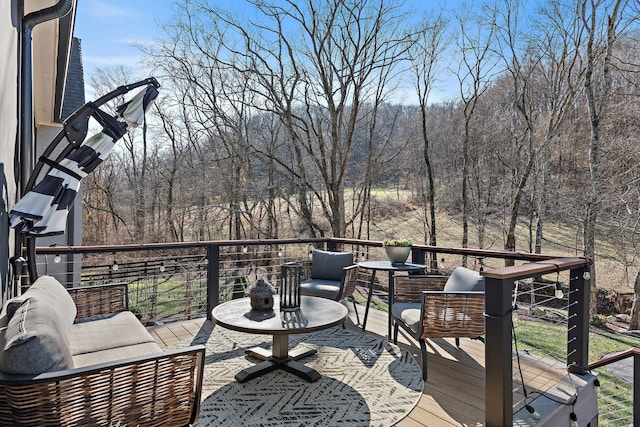 wooden terrace featuring an outdoor living space