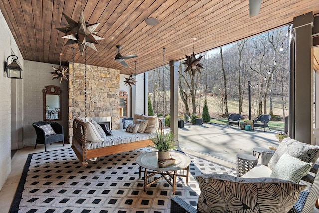 view of patio / terrace featuring ceiling fan and an outdoor living space