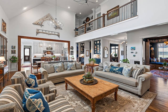 living room featuring hardwood / wood-style flooring, plenty of natural light, and a chandelier