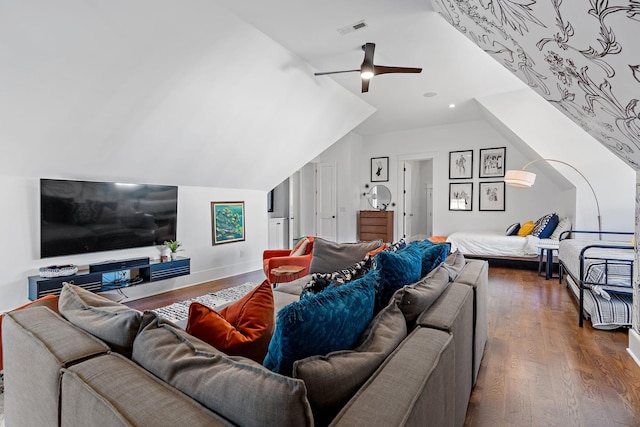 living room featuring lofted ceiling, dark wood-type flooring, and ceiling fan