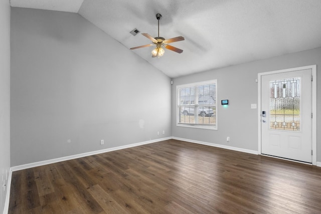 entrance foyer featuring ceiling fan, lofted ceiling, and dark hardwood / wood-style flooring