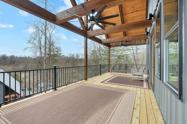 wooden deck featuring ceiling fan