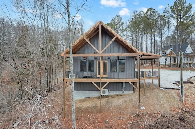 back of property featuring covered porch