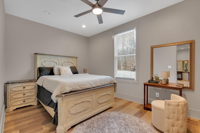 bedroom featuring ceiling fan and light hardwood / wood-style floors