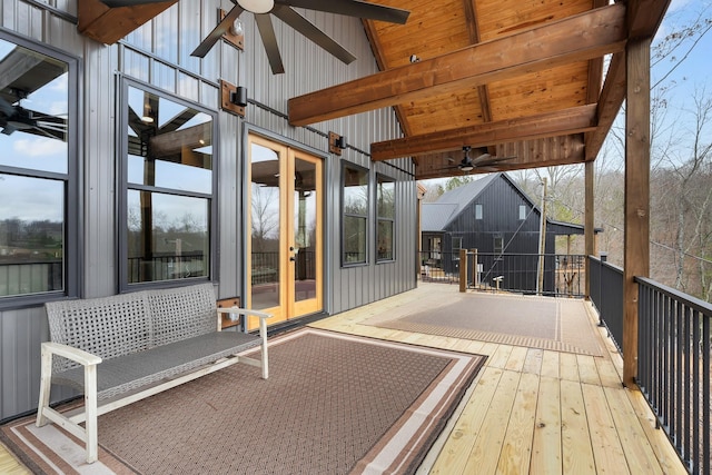 wooden terrace featuring ceiling fan and french doors