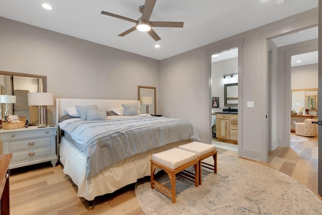 bedroom with ceiling fan and light hardwood / wood-style floors