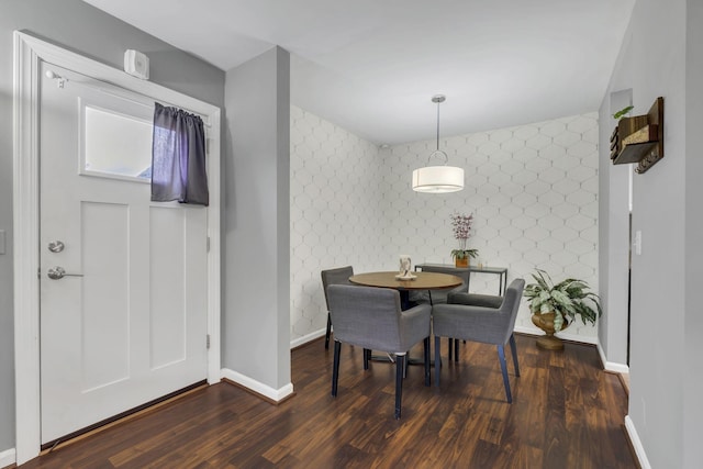 dining area with dark hardwood / wood-style floors