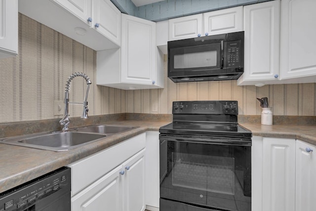 kitchen with sink, white cabinets, and black appliances