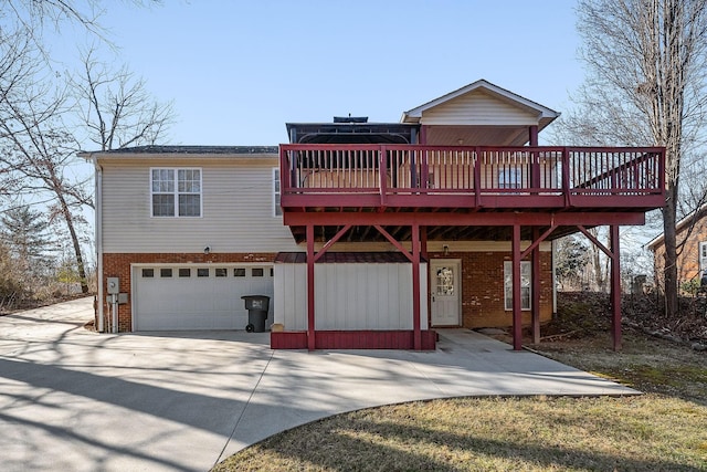 view of property with a garage and a deck